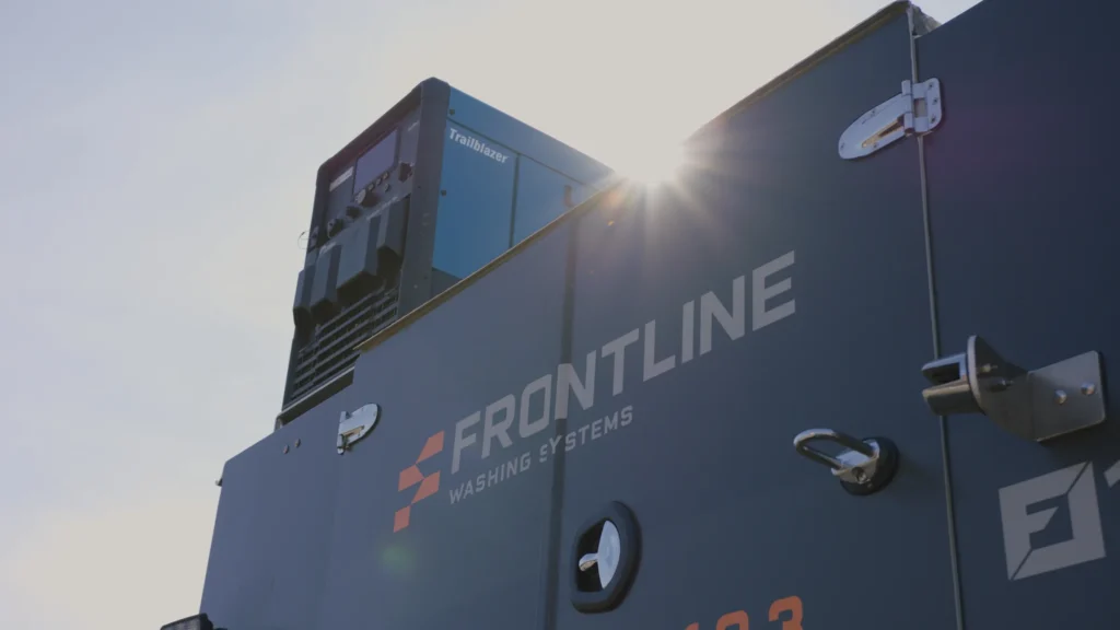 Sun flares over a Frontline Washing Systems service truck