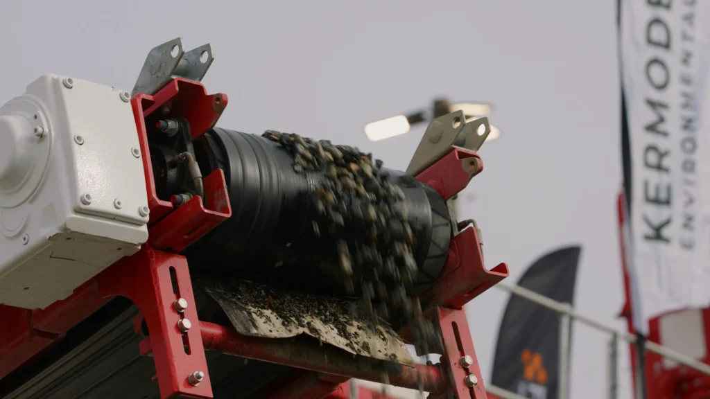 Close-up of aggregate dropping off conveyor