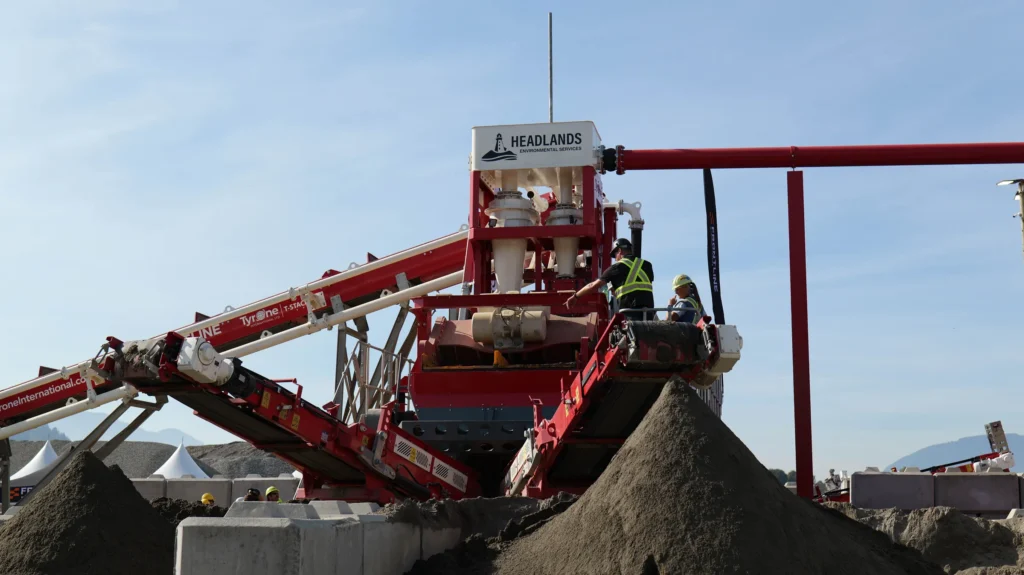 Two people on the wash plant platform